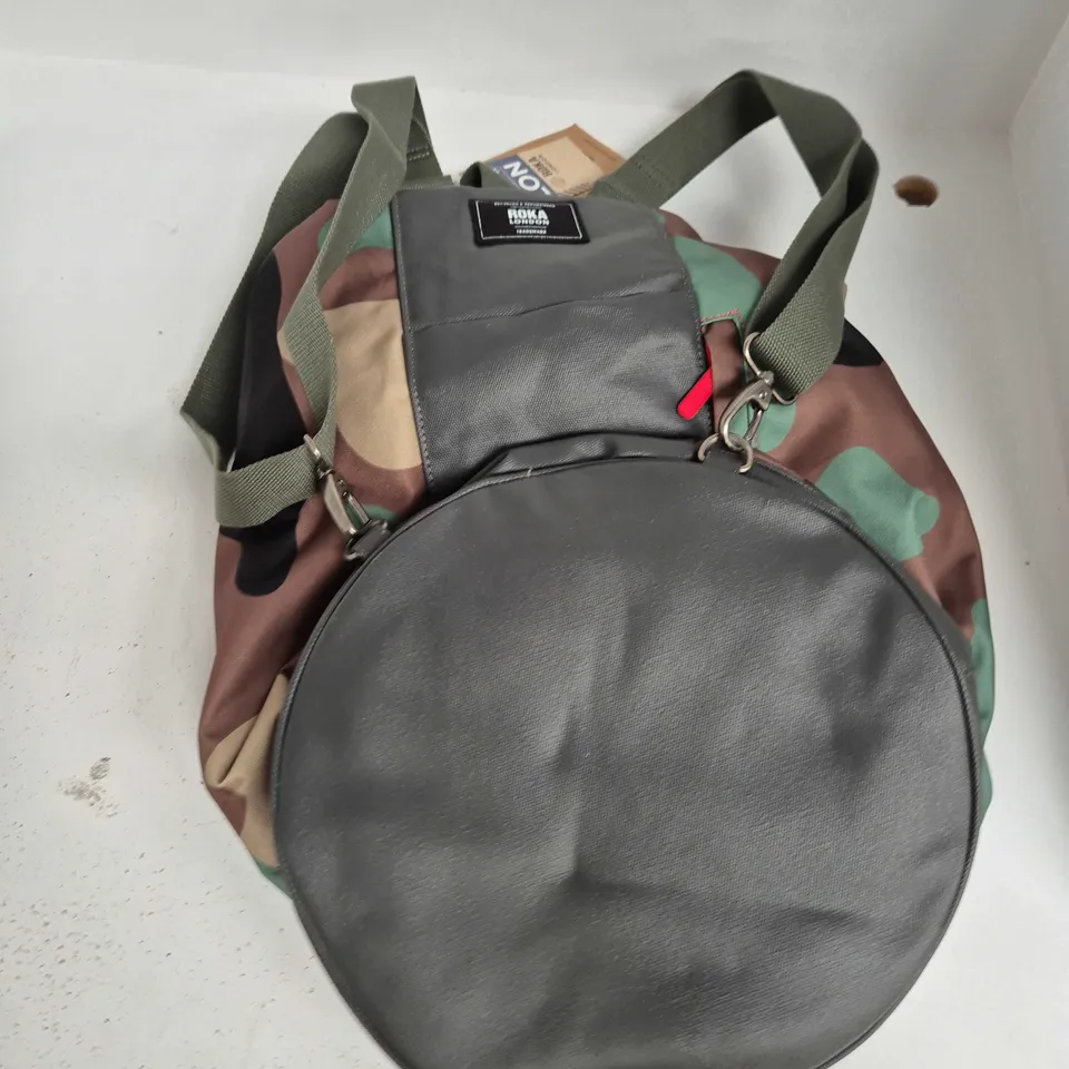 ROKA LONDON CAMOUFLAGE ROUND BAG WITH RED ZIP AND WEBBING STRAPS