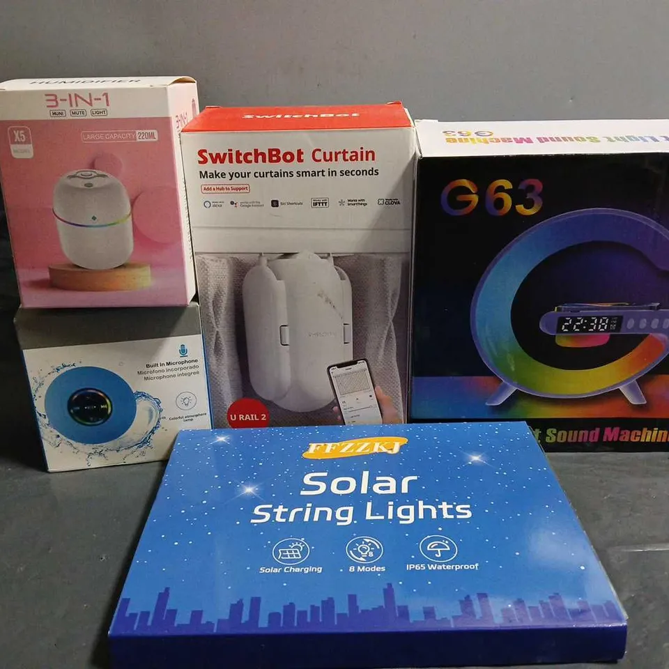 APPROXIMATELY 10 ASSORTED ITEMS TO INCLUDE - SWITCH BOT CURTAINS , SOLAR STRING LIGHTS , SMART LIGHT SOUND MACHINE ETC