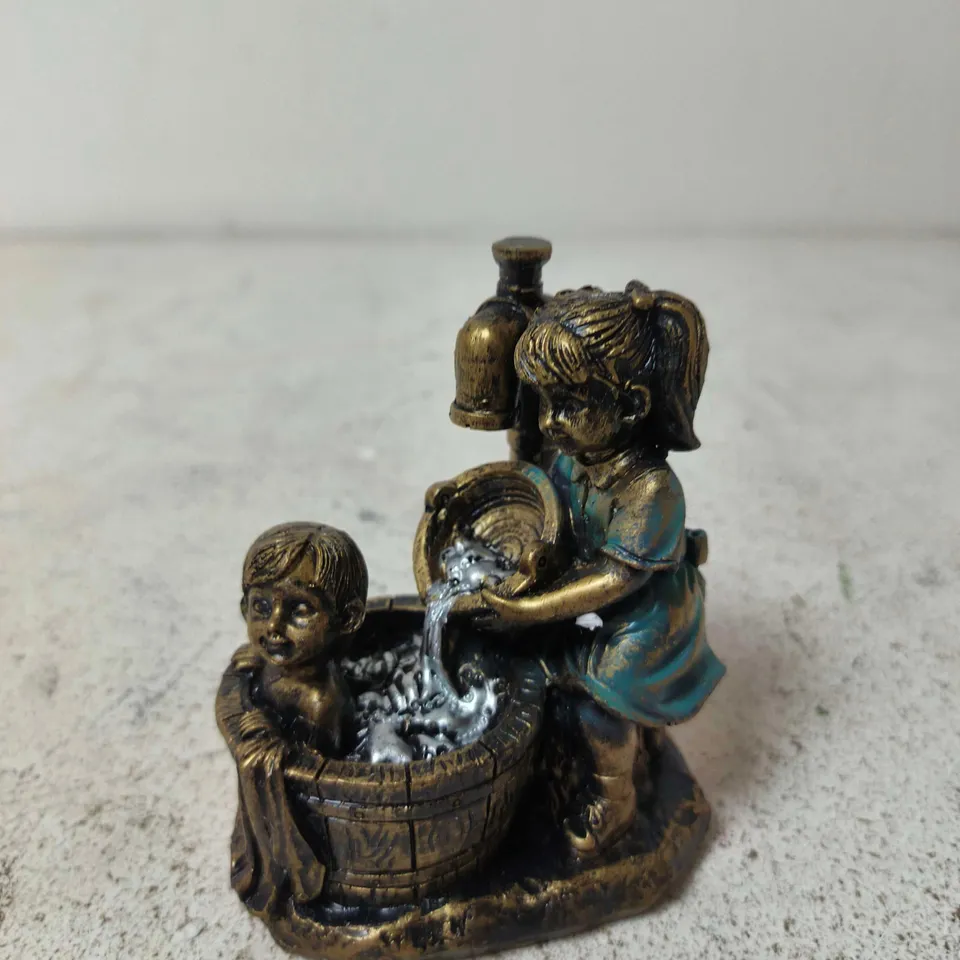 BOY AND GIRL GARDEN STATUE A CHILD GARDEN STATUE