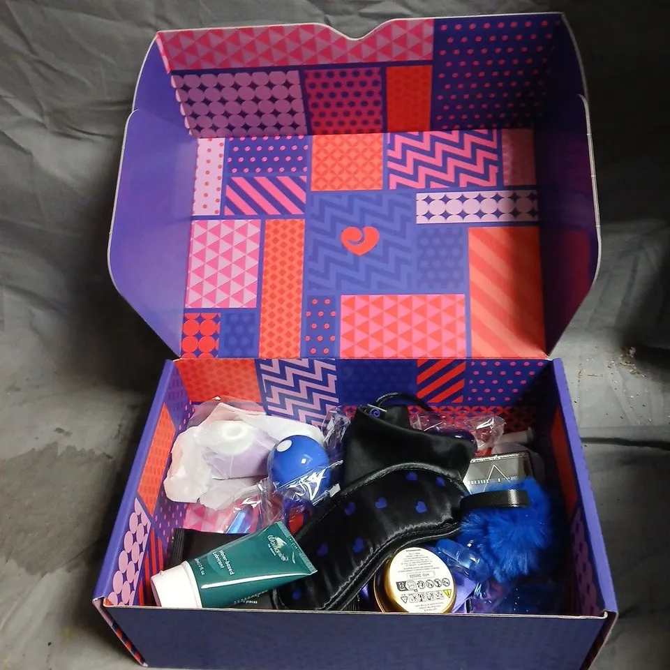 GIFT BOX OF ASSORTED SEX TOYS AND GAMES INCLUDING WATER BASED LUBRICANT , BLINDFOLD , SCENTED CANDLE