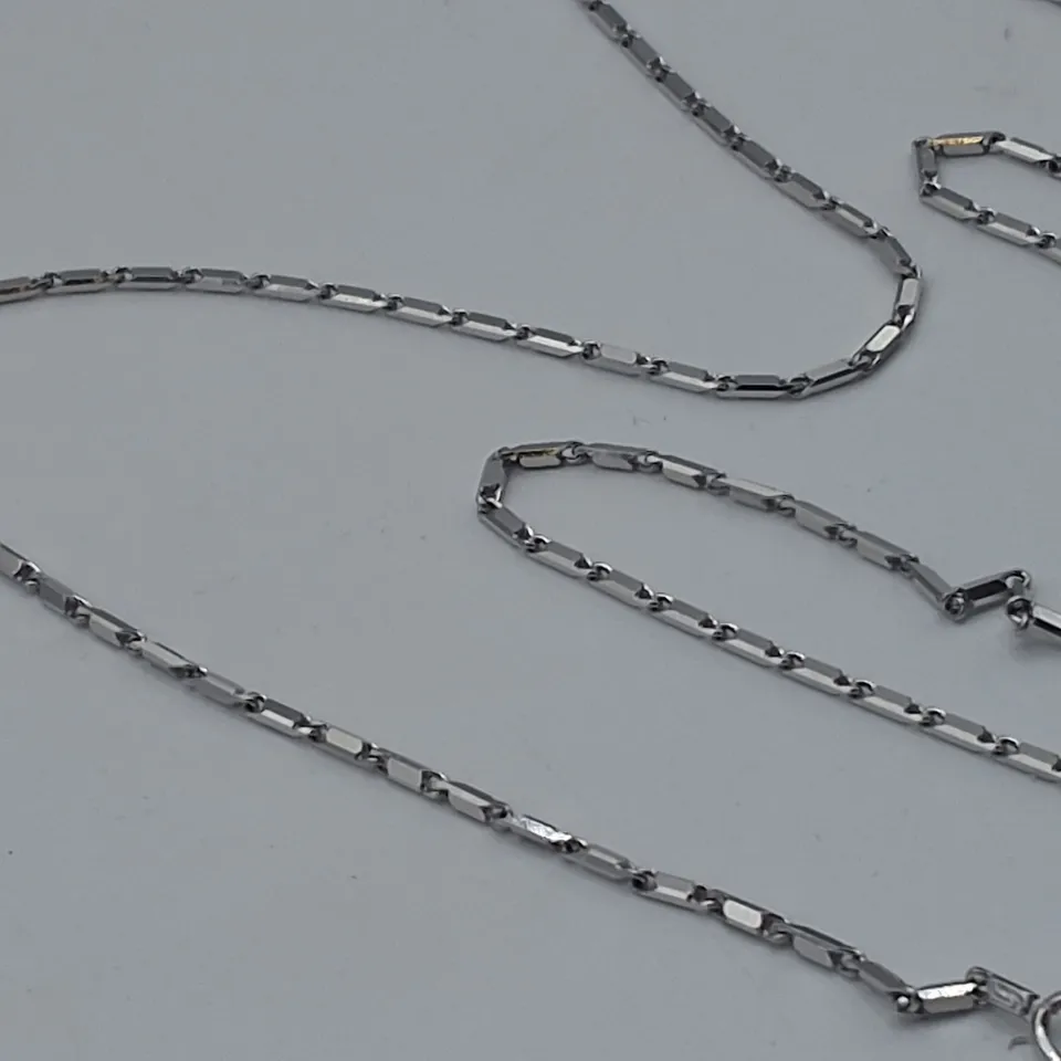 18CT WHITE GOLD SALTIRE PENDANT ON CHAIN SET WITH NATURALS