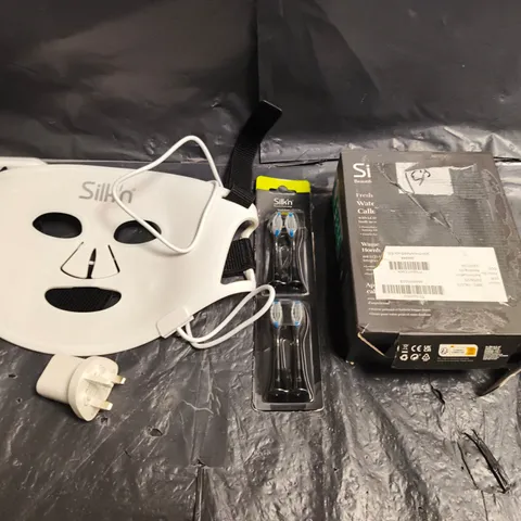 BOX OF APPROXIMATELY 5 SILK'N BEAUTY PRODUCTS TO INCLUDE REPLACEMENT TOOTHBRUSH HEADS, CALLOUS REMOVER AND LED FACE MASKS