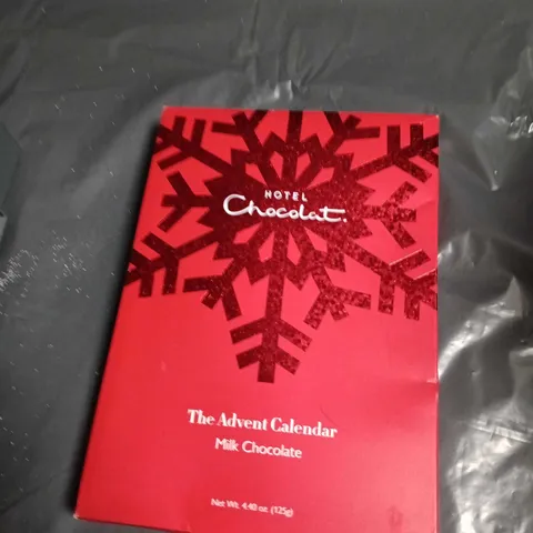 APPROXIMATELY 11 ASSORTED FOOD AND DRINK ITEMS INCLUDING HOTEL CHOCOLAT ADVENT CALENDAR . GREEN CHILLI SAUCE AND HUEL CHOCOLATE DRINK 