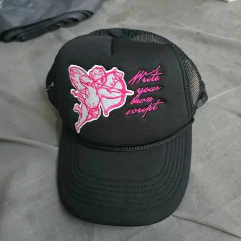 BLACK TRUCKER CAP WITH PINK EMBROIDERY – 'WRITE YOUR OWN SCRIPT' 