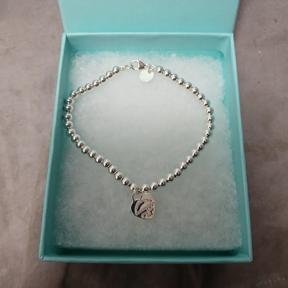 TIFFANY & CO. SILVER BEAD BRACELET WITH HEART CHARM – BOXED