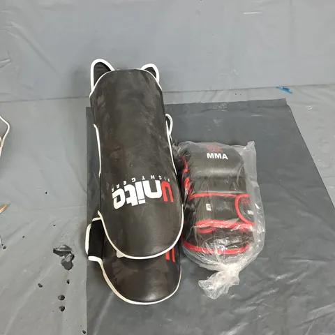 BOX OF ASSORTED MMA ITEMS TO INCLUDE SHIN GUARDS AND PADDED GLOVE
