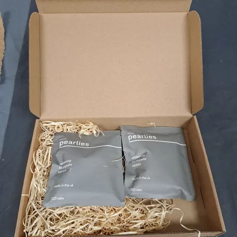 BOX OF APPROXIMATELY 30 PACKS OF PEARLIES TOOTHPASTE WHITENING TABLETS