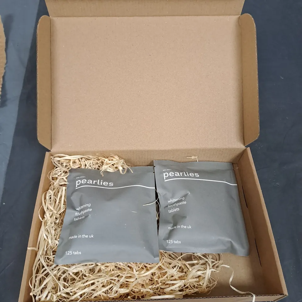 BOX OF APPROXIMATELY 30 PACKS OF PEARLIES TOOTHPASTE WHITENING TABLETS