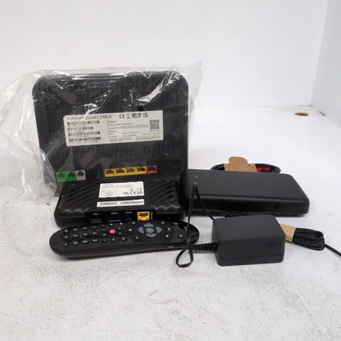 TOTE OF APPROXIMATELY 15 ASSORTED ITEMS TO INCLUDE TV BOX MINI, ROUTER, POWER SUPPLY, CABLES, REMOTE CONTROLS ETC