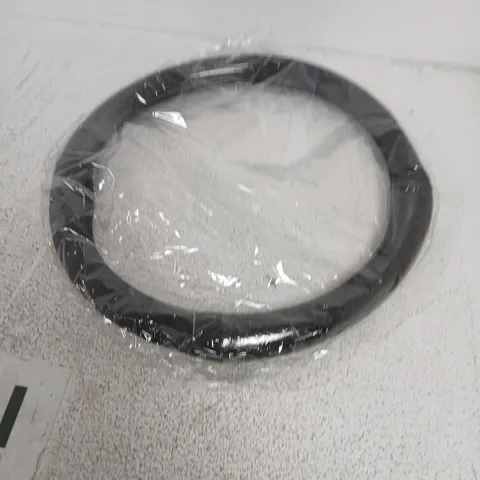 Black circular steering wheel cover – new in packaging
