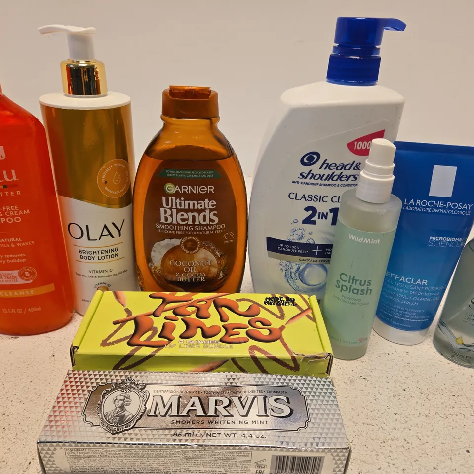 APPROX 12 ASSORTED BEAUTY PRODUCTS TO INCLUDE CANTU SHAMPOO, OLAY BODY LOTION, WILD MINT TONER, ETC 