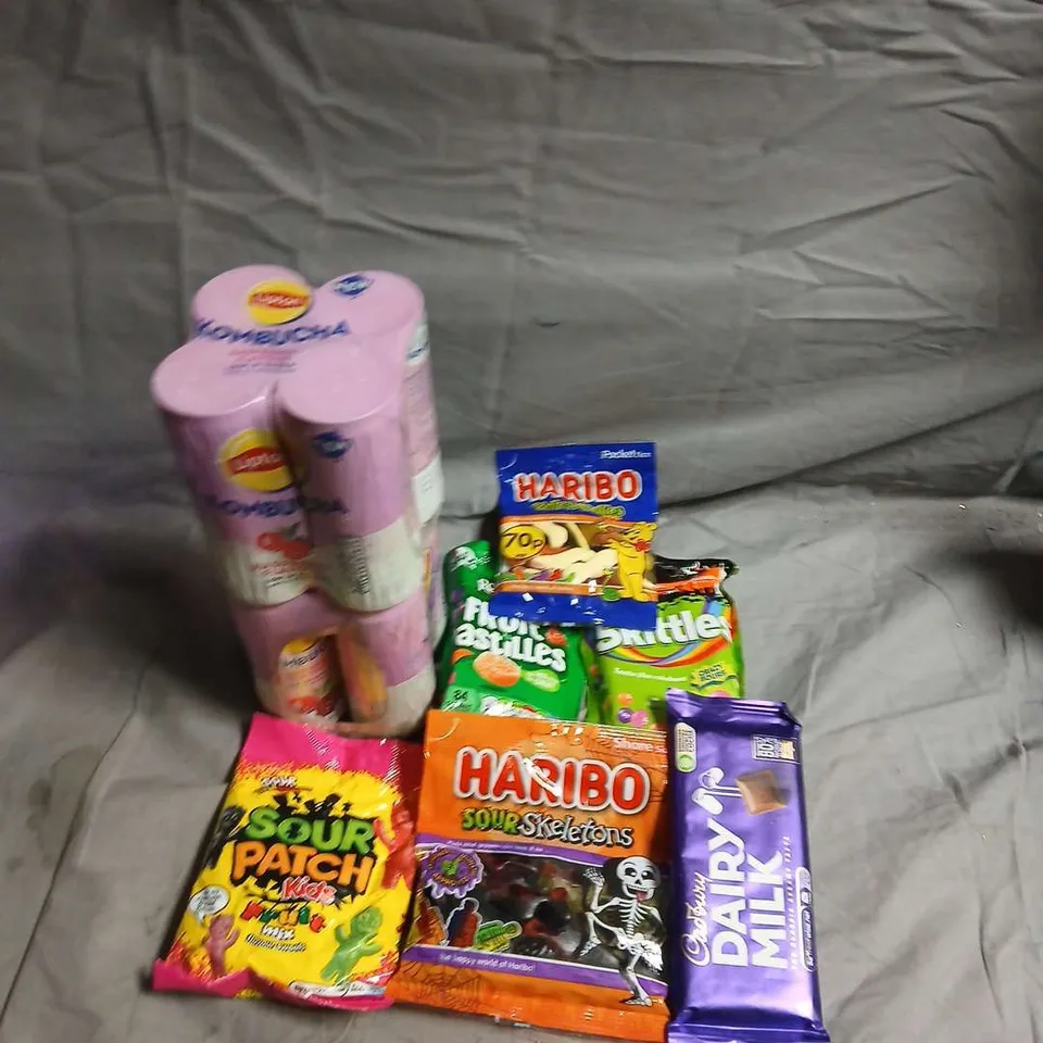 APPROXIMATELY 10 ASSORTED FOOD ITEMS TO INCLUDE - DAIRY MILK, HARIBO'S AND SOUR PATCH KIDS - COLLECTION ONLY 