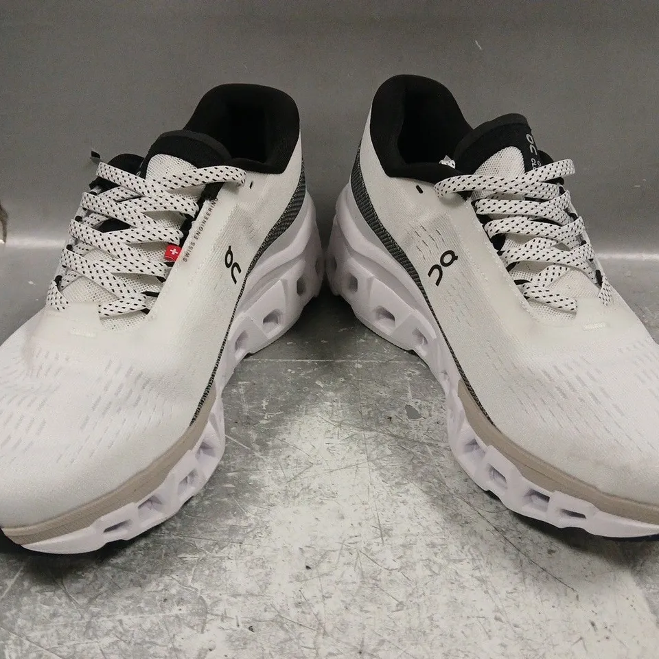 PAIR OF ON CLOUDMONSTER RUNNING SHOES IN WHITE/BLACK SIZE UK 8