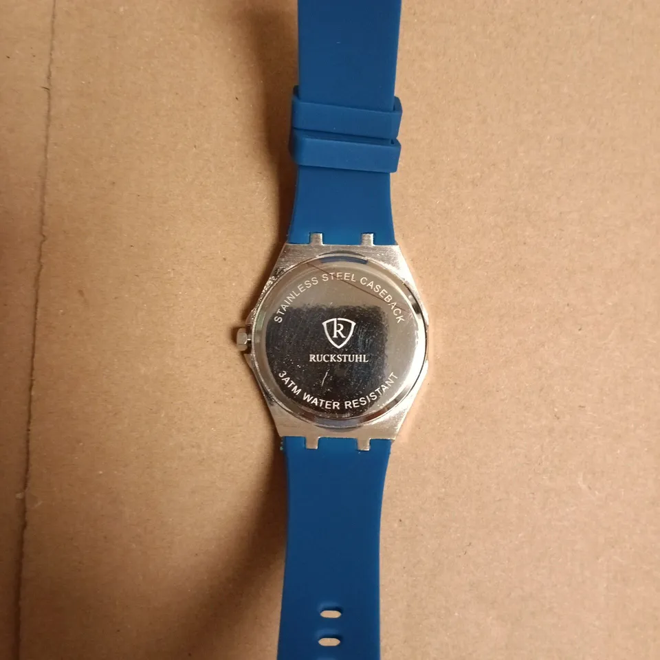 BOXED RUCKSTUHL STAINLESS STEEL WATCH WITH BLUE SILICONE STRAP
