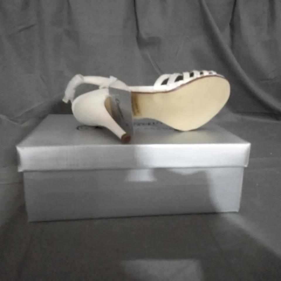 APPROXIMATELY 12 BOXED PAIR OF CASANDRA IVORY HEELED SANDALS IN VARIOUS SIZES TO INCLUDE SIZE 5