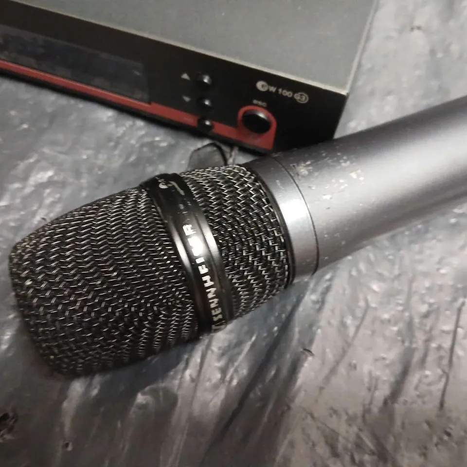 Sennheiser EW 100 wireless microphone system with handheld mic, true diversity receiver, and green Flipo case