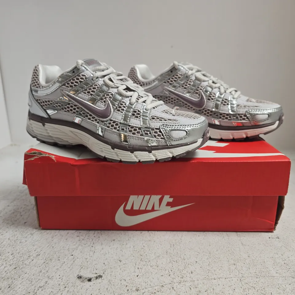 BOXED PAIR OF NIKE P-6000 TRAINERS IN SILVER SIZE UK 2.5