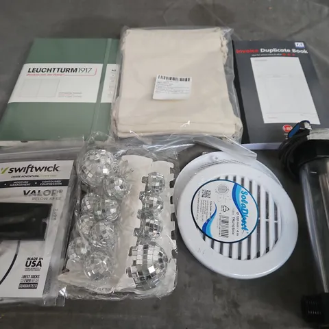 APPROXIMATELY 10 ASSORTED HOUSEHOLD ITEMS TO INCLUDE - DUPLICATE BOOK , MINI DISCO BALLS , KNEE BRACES , ETC 