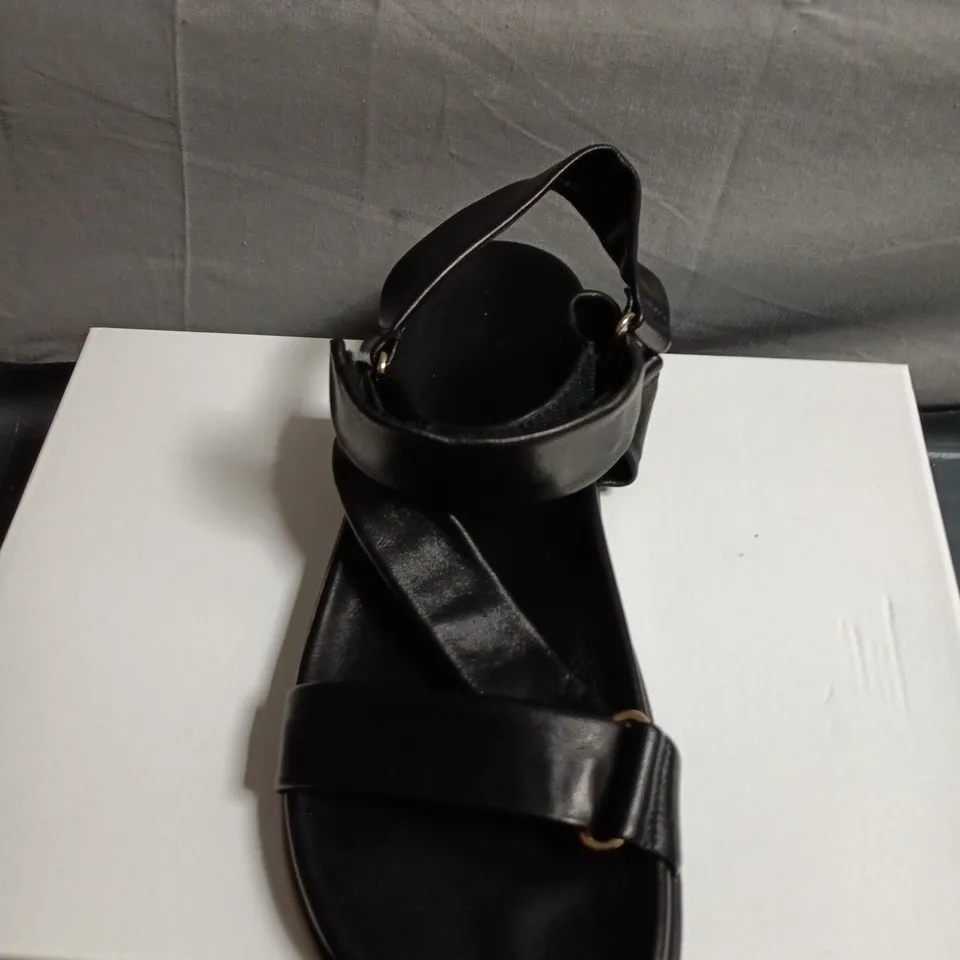 BOXED PAIR OF RUSSELL AND BROMLEY BLACK LEATHER SANDALS - SIZE 40