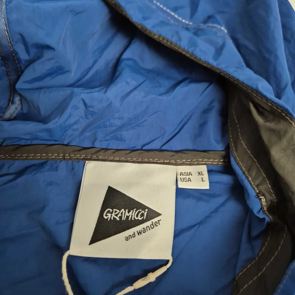GRAMICCI X AND WANDER BLUE WINDBREAKER JACKET – UK XL (US XL, ASIA XL)