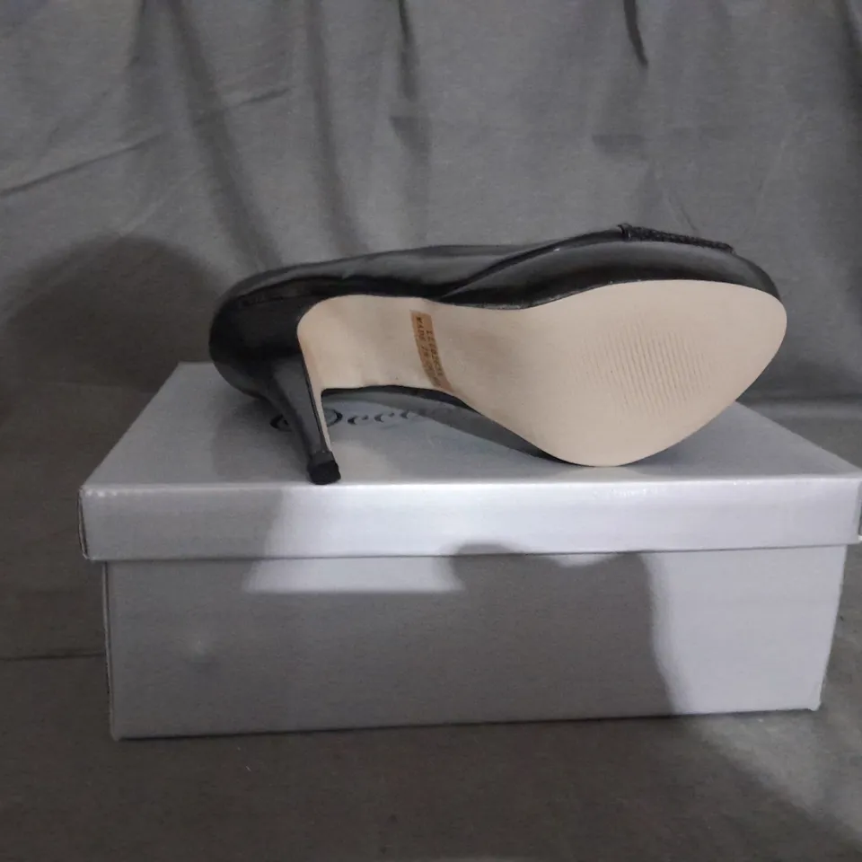 APPROXIMATELY 12 BOXED PAIR OF CASANDRA HEELED OPEN TOE SHOES IN BLACK VARIOUS SIZES TO INCLUDE SIZE 6