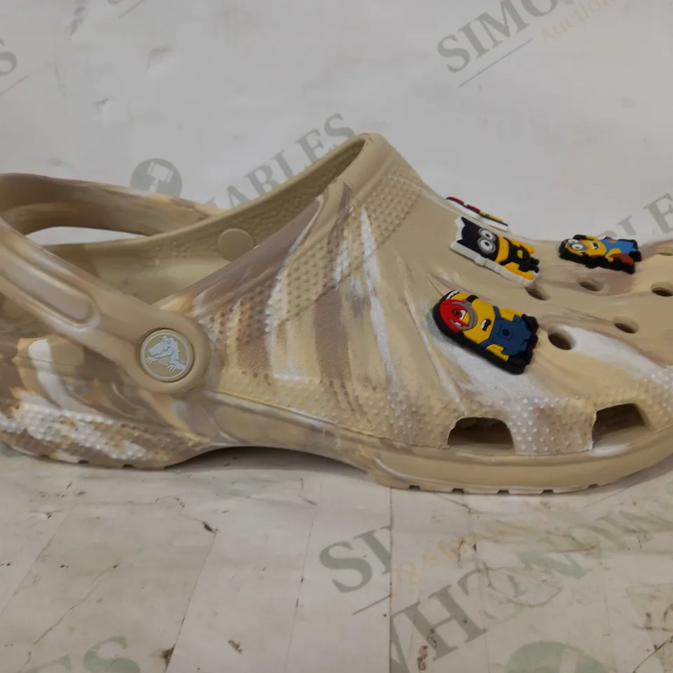 BOXED PAIR OF CROCS CLASSIC MARBLED CLOGS IN SAND COLOUR W. MINIONS CHARMS SIZE M11
