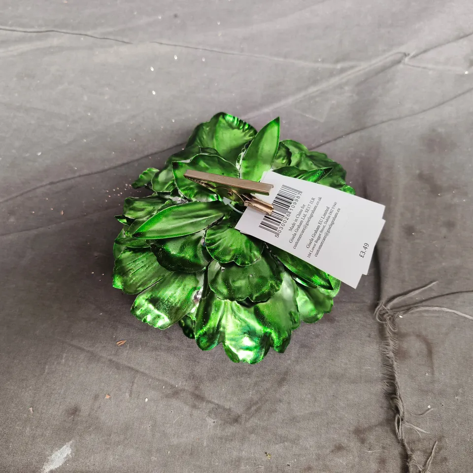 APPROXIMATELY 24 GREEN METALLIC ARTIFICIAL FLOWER DECORATIVE ORNAMENTS WITH CLIPS