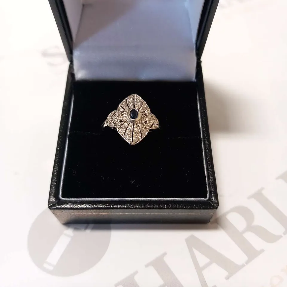 18CT WHITE GOLD DRESS RING SET WITH A NATURAL SAPPHIRE AND DIAMONDS