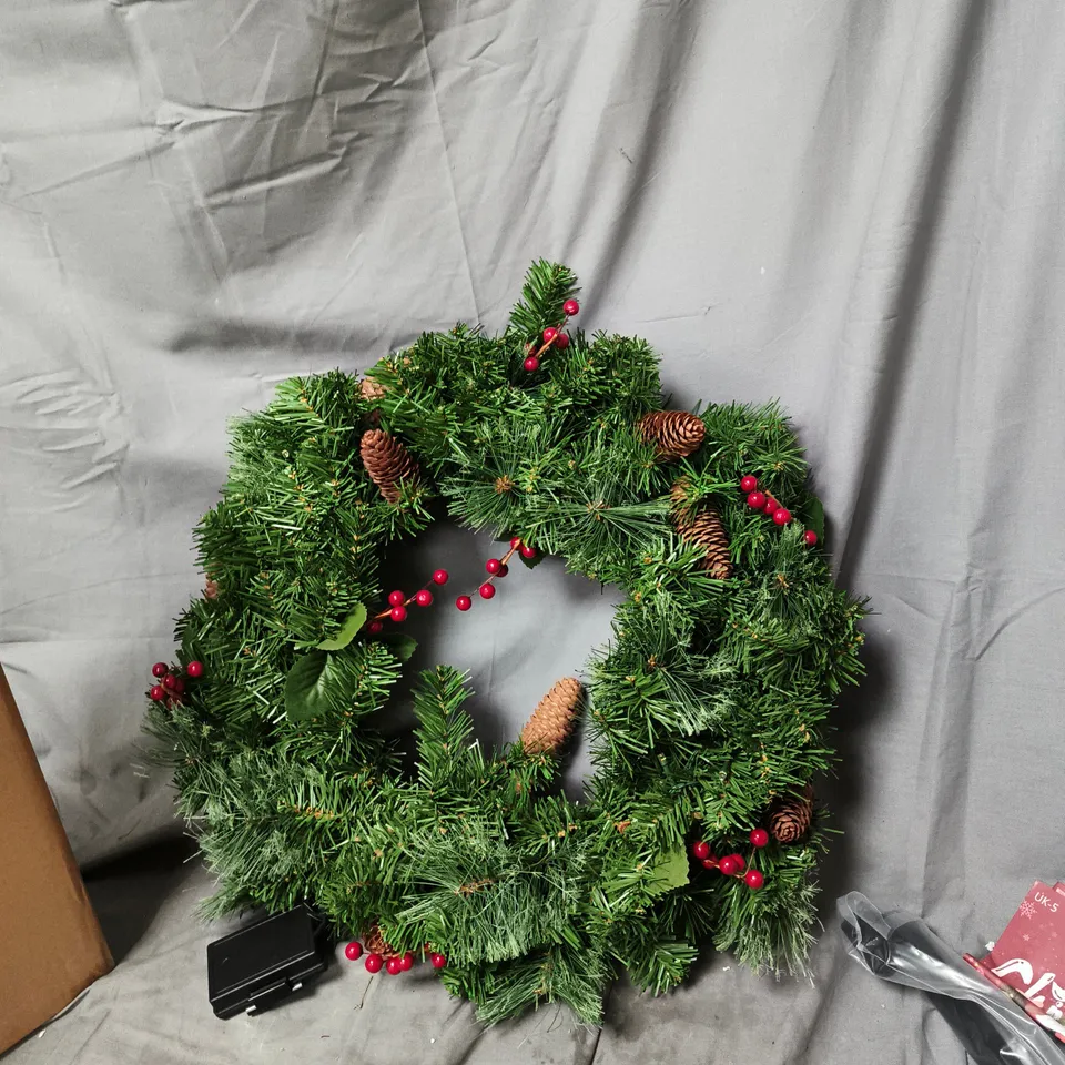 ARTIFICIAL CHRISTMAS WREATH WITH PINE CONES AND RED BERRIES
