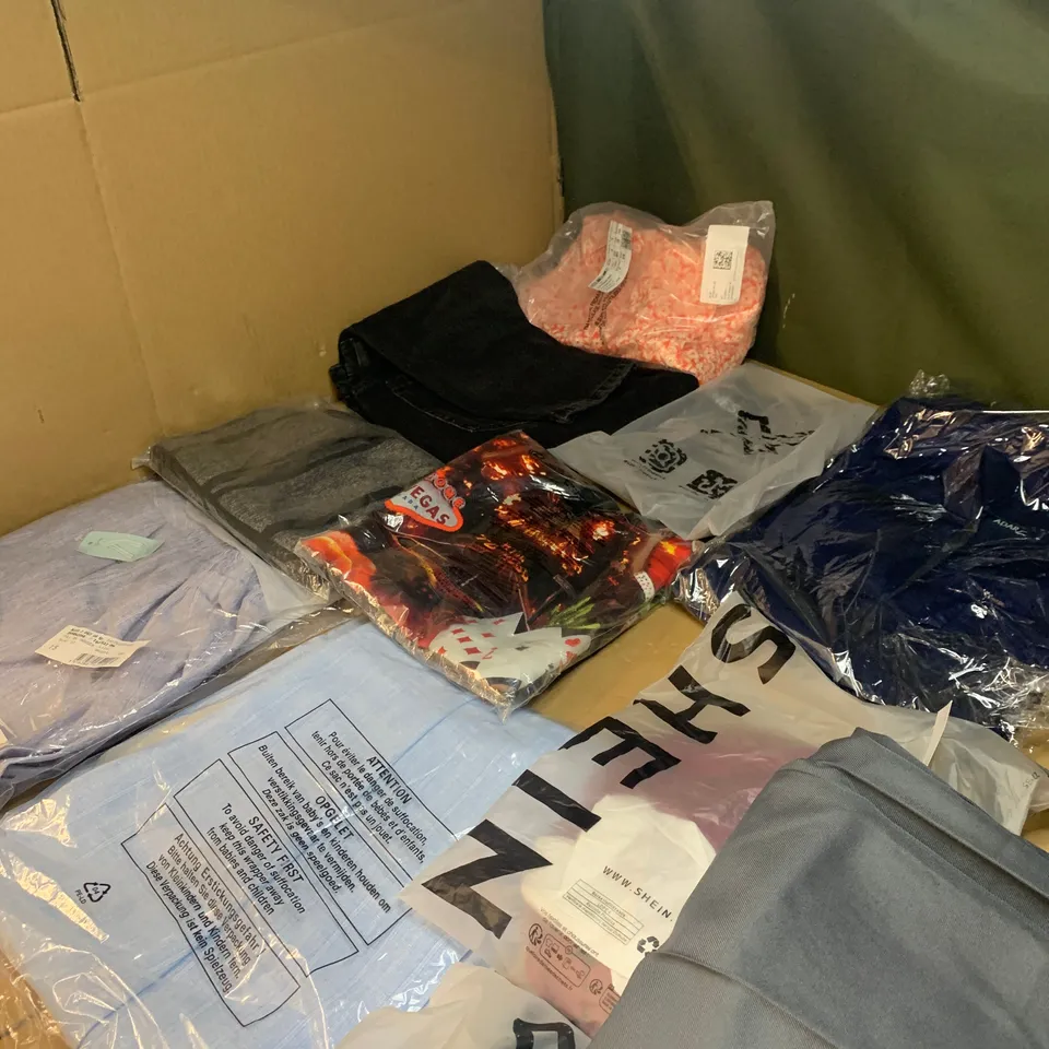 Medium box of assorted clothing items to include T-shirts, trousers and dresses