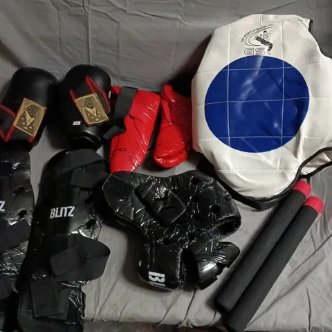 LOT OF PROTECTIVE MARTIAL ARTS EQUIPMENT TO INCLUDE GLOVES, HEADPIECE, SHIN GUARDS AND MORE