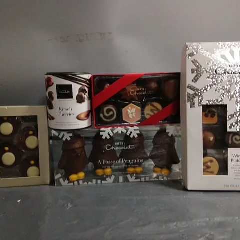 TOTE OF APPROX 6 ASSORTED FOOD ITEMS TO INCLUDE - HOTEL CHOCOLAT WINTER PUDDINGS , HOTEL CHOCOLAT A POSSE OF PENGUINS , HOTEL CHOCLAT KIRSCH CHERRIES ETC