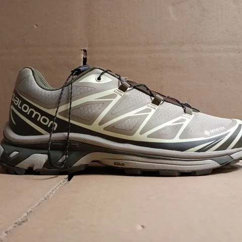 BOXED PAIR OF SALOMON TRAINERS IN LIGHT TAUPE SIZE UK 9.5