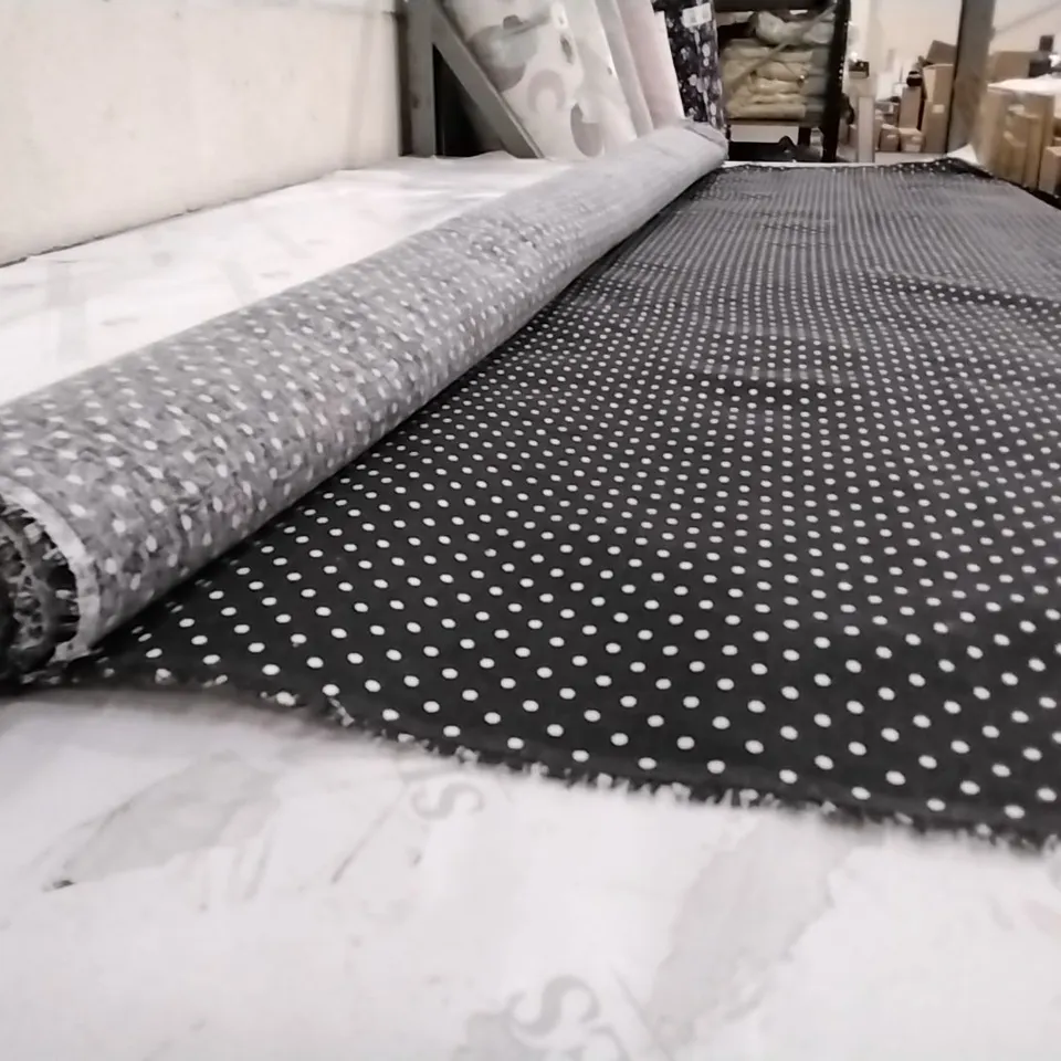 ROLL OF BLACK DOTTED FABRIC 