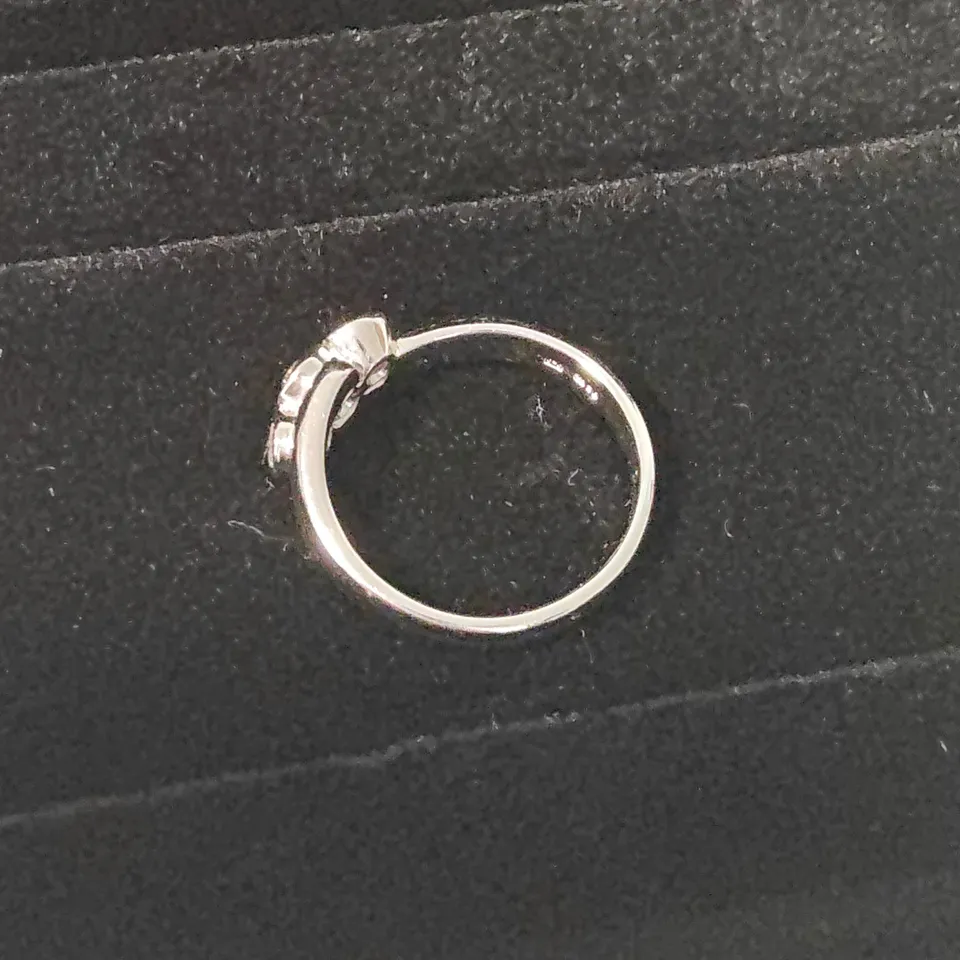 18CT WHITE GOLD THREE STONE RING SET WITH A NATURAL DIAMONDS WEIGHING +-0.42CT