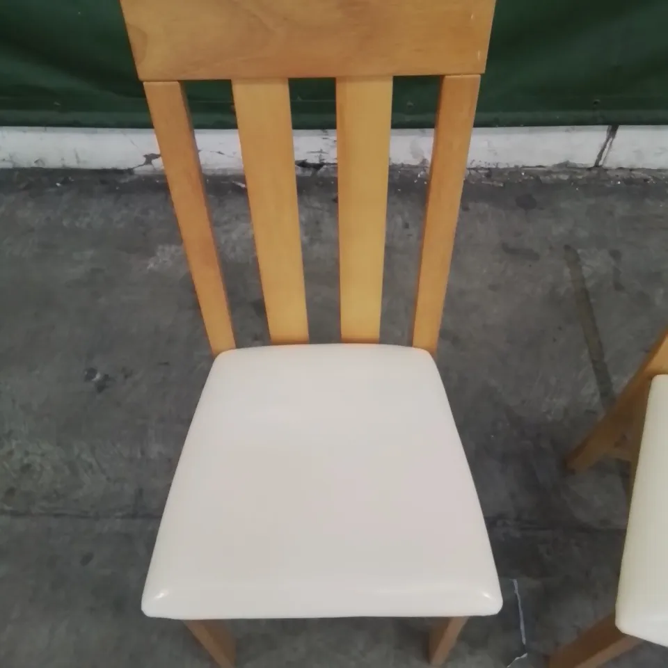 A PAIR OF DESIGNER LEATHER UPHOLSTERED HARD BACK DINNING CHAIRS