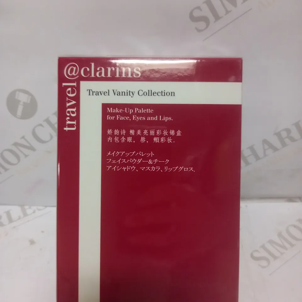 BOX OF APPROX 11 SEALED CLARINS TRAVEL VANITY COLLECTION 