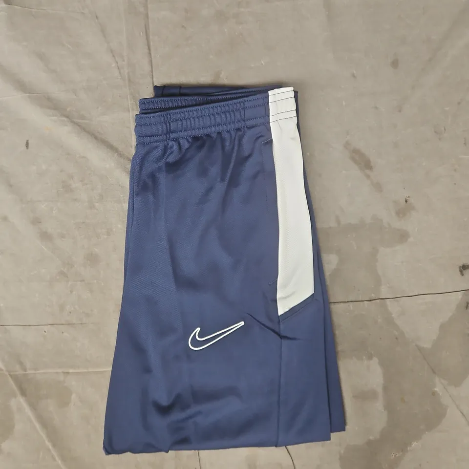 NIKE TRACK PANTS IN NAVY/WHITE SIZE XL