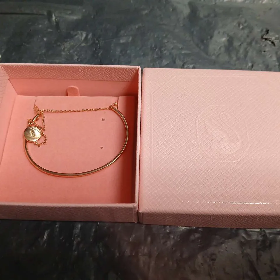 BOXED SWAROVSKI GOLD-TONE BRACELET WITH HEART CHARM 