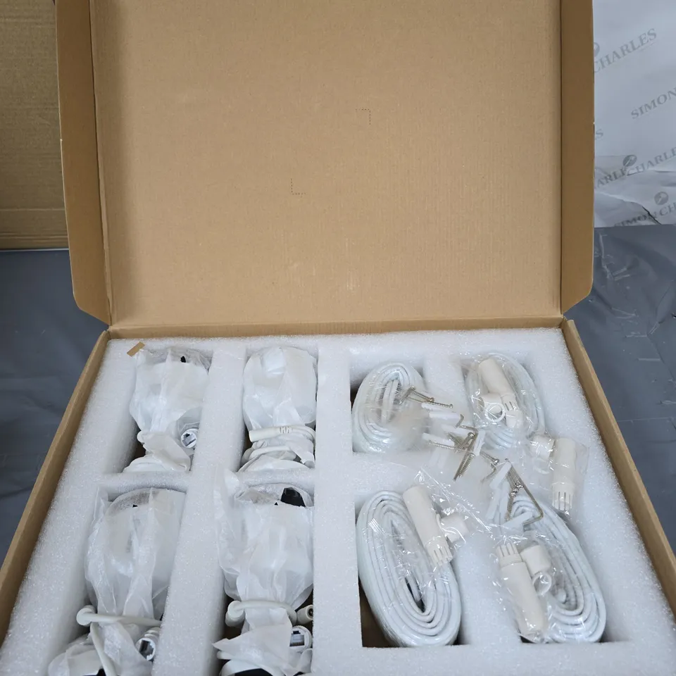 SWANN FOUR WHITE CCTV SECURITY CAMERAS WITH MOUNTING BASES AND CABLES