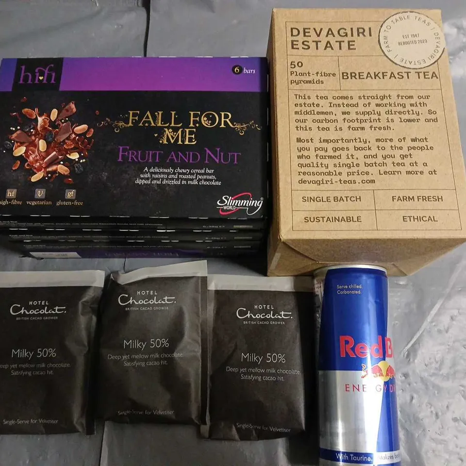 LOT OF ASSORTED FOOD AND DRINK ITEMS TO INCLUDE MILK CHOCOLATE DRINKS, BREAKFAST TEAS, RED BULL AND SNACK BARS