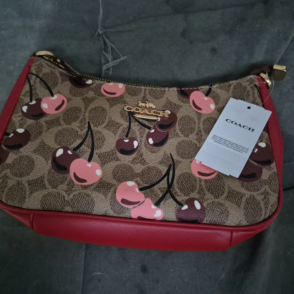 COACH HANDBAG – CHERRY PRINT CANVAS WITH RED LEATHER TRIM