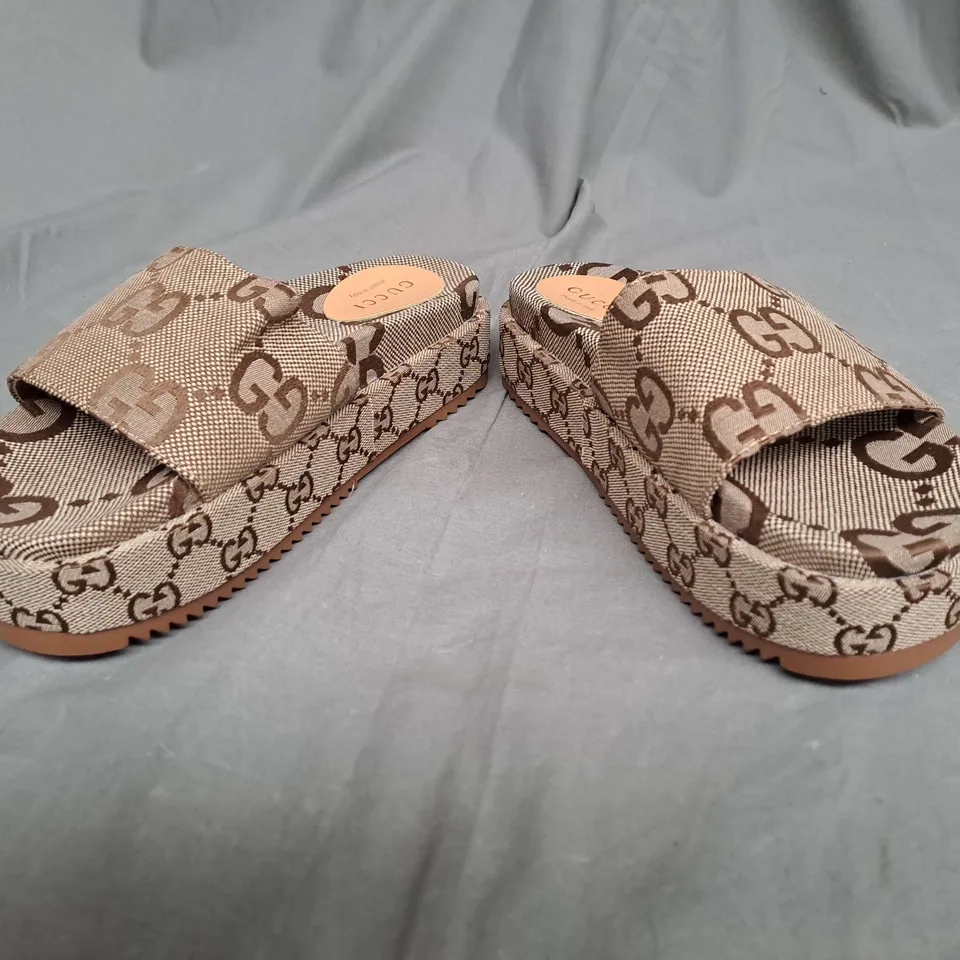 PAIR OF GUCCI PLATFORM SLIDES IN BROWN SIZE 38