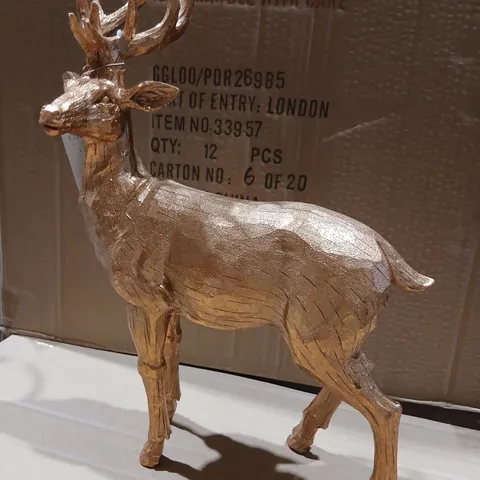 FOUR GISELA GRAHAM GOLD-TONE STAG FIGURINE SCULPTURE