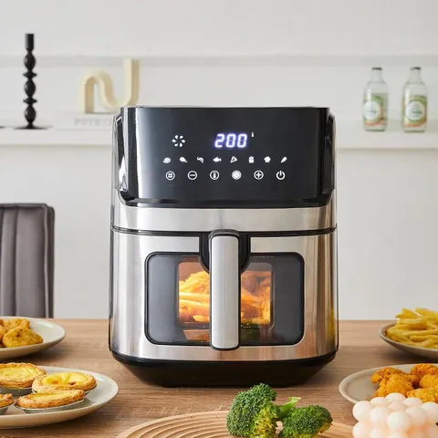 A BOXED TTAF-501MST AIR FRYER IN BLACK
