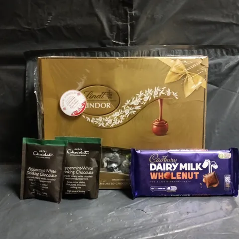 APPROXIMATELY 8 ASSORTED FOOD AND DRINK ITEMS TO INCLUDE LINDT, CADBURY, HOTEL CHOCOLAT, ETC