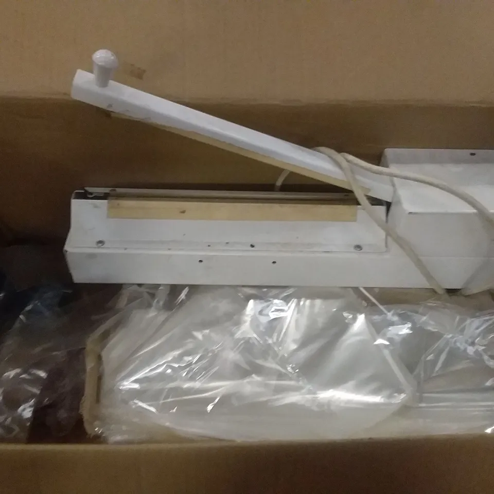 BOXED BAG SEALING MACHINE