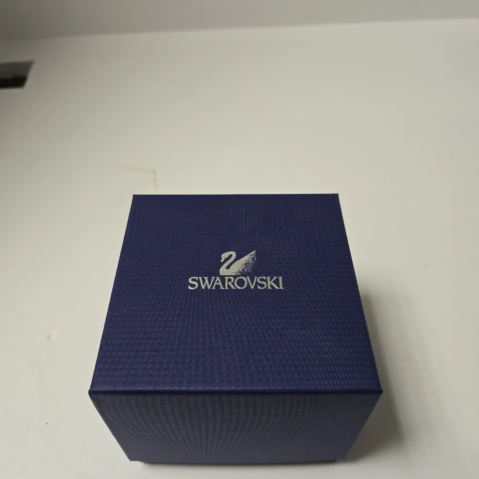 SWAROVSKI WRISTWATCH WITH RED DIAL AND CRYSTAL-SET BEZEL – IN BLUE PRESENTATION BOX