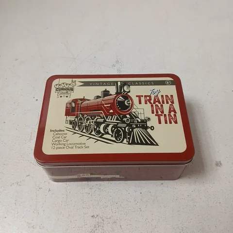 CURIOUS CATERPILLAR TOY TRAIN IN A TIN SET 