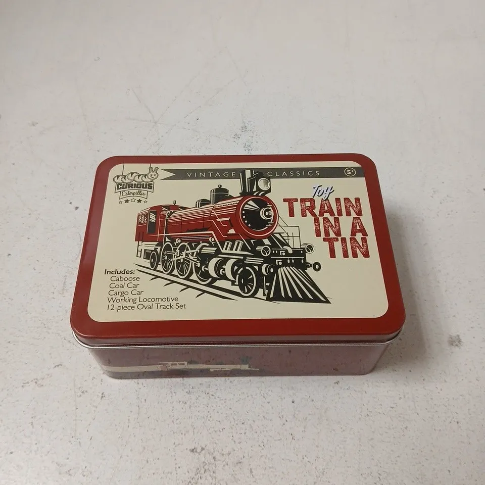 CURIOUS CATERPILLAR TOY TRAIN IN A TIN SET